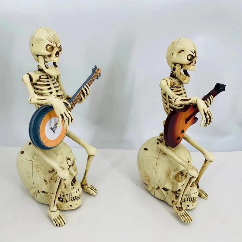 Rock & Roll Sit Skeleton tocando estatueta de guitarra elétrica